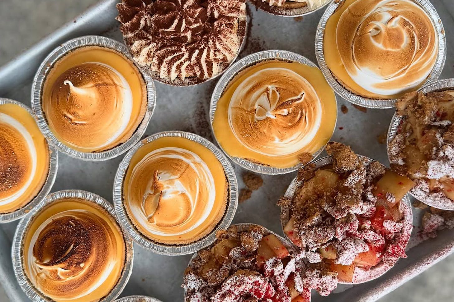 Lemon meringue, berry crumble and tiramisu baby tarts